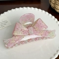 Pinza per capelli rosa a forma di fiocco con texture maculata bianca su un piatto - 11.4cm / Rosa