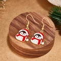 Festive Christmas penguin earrings with gold hooks and red enamel finish on wood - Penguin with Red Santa Hat Style (E00898G)