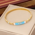 Gold stainless steel evil eye bangle with light blue enamel finish in a jewelry box - Rectangular Blue Enamel Evil Eye Style (6#)