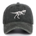 Close-up of dinosaur skeleton embroidery on washed dark grey cotton baseball cap - One Size / Army Green