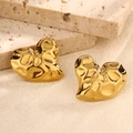 Detailed close-up of golden heart-shaped stud earrings with unique hammered metal texture - Hammered Gold-Tone Heart Style (Style 9)