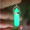 Luminous green glowing quartz point pendant with a hexagonal bullet shape crystal design - Luminous Stone