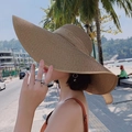 Stylish khaki straw sun hat for beach vacations featuring a wide brim and woven texture - M (56-58cm) / Khaki With Khaki Bowknot