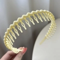 Non-slip wavy hairband in cream yellow finish for daily hair styling and washing - Off-White