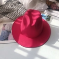 Detailed close-up of rose red wool felt fedora with stylish wide brim and jazz style - M (56-58cm) / Rose Red