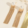 Macro shot of gold long tassel earrings with white pearls and delicate metallic chains - Short Tassel Earrings (ES2320-5)