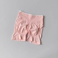 Close-up of pink seamless yoga shorts featuring a high waistband and scrunch butt detail - Light Pink