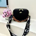 Black square box bag with gold hardware and patterned wide strap in a minimalist design - Black (Brown Strap)