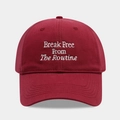 Close-up of burgundy cotton baseball cap with white Break Free From The Routine embroidery - Burgundy