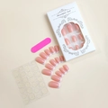 Close-up of French tip press-on nail kit with adhesive tabs and pink nail file tool - French Pink and White