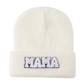 Detailed view of MAMA towel embroidery and soft knit texture on cream white beanie - Milky White