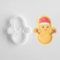 Snowman shaped cookie mold with white plastic cutter and decorated icing biscuit - Snowman A