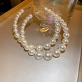 Close-up of oversized gold hoop earrings featuring gradient white pearls in a retro style - 24# Steel Needle - Earplug - White
