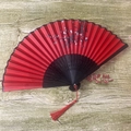 Traditional red folding fan with plum blossom pattern and black bamboo ribs - No.36 Red Plum Joy Fan