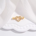 Nahaufnahme eines goldenen Herzverschlusses mit funkelnden Zirkonia-Steinen - Goldene Herzschnalle / 10*21mm