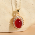 Elegance 14K gold-plated necklace featuring a red oval resin stone with halo rhinestones - Glossy Resin Red
