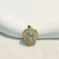 Elegant gold plated heart pendant with micro-inset zircons on white textured background - Teardrop Zircon Heart