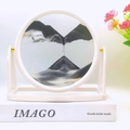 Circular hourglass sand art in white frame with black, white and gold flowing sand - 8 Inch White Frame Stand Black