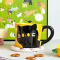 Detail of creative yellow ceramic cat mug with black handle and kitten illustration - Simple Foam Pack / Black