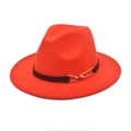 Detail of red wool fedora hat featuring a black band with a gold pin buckle accent - Orange Red