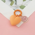 Orange heart keychain with purple smiley face charm and matching silicone ring accessory - Heart Smiley Face / Orange