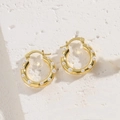Elegant gold hoop earrings with white pearls on a textured white stone base - C-Shaped Pearl Earrings