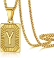 Close-up of square gold letter Y pendant with matte texture and radial edges on box chain - Letter Y