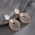 Elegant gold drop earrings with sparkling white zircon in multi-layered oval design - Full White Pear Oval / Gold