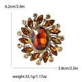 Amber crystal rhinestone brooch in warm gold finish measuring 6.2cm height and 5.8cm width - Brown
