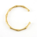 Bracciale a polsino dorato in acciaio inossidabile con design a bambù in stile minimalista - Oro