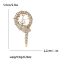 Spilla a forma di serpente dorato con strass e goccia di cristallo, 5,0x2,7 cm - Oro