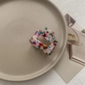 Artistic close-up of a colorful marble pattern acetate hair claw clip on a ceramic tray - Small Square Claw / Multicolor