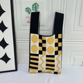 Knitted tote bag with yellow and black geometric patterns and stripes - Black Background With Yellow Dots