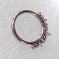 316L stainless steel nose ring hoop with beads and spiked studs on textured background - 1.2x8mm / Steel