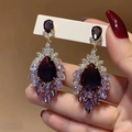 Elegant gold drop earrings with purple pear-cut crystals and sparkling diamond tassels - Purple