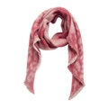 Close-up of pink and red leopard pattern scarf with soft fringed edges and wool texture - Leopard Red