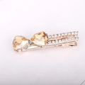 Rose gold bow hair clip with amber heart crystals and sparkling rhinestones - Yellow