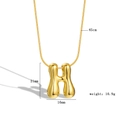 Macro view of golden puff initial H pendant with measurements and snake chain details - Letter H
