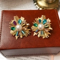 Macro view of vintage gold stud earrings with central pearl and colorful gemstones - Fireworks Radial Stud Style (28#) / Gold Multicolor