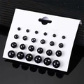 Set of 12 pairs of glossy black pearl stud earrings in various sizes on a white card - 12 Pairs Set / Black