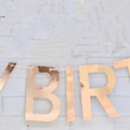 Shiny golden foil Happy Birthday banner close-up for birthday party wall decoration - Solid Rose Gold