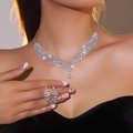 Sparkling silver floral jewelry set with multi-layer necklace and tassel earrings on a model - Multi-Layer V-Shape Pave Style (DTN14026912S)