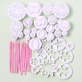 33-piece fondant cake tool set with white plungers and pink sculpting pens on green background - 47pcs Set 03097