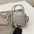 Gray hand-woven faux leather tote bag with round handles and tassel charm detail - Gray