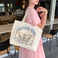 Large beige canvas tote bag with cartoon bear illustration and double shoulder straps - Dating Bear