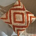 Bohemian geometric tufted pillow cover in beige and caramel orange with corner tassels - Bohemian Orange