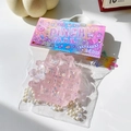 Rosa Glitzer-Waffel-Quetschspielzeug mit Perlen und Schmetterlingsdeko in PINCH-Box - Kristall Polarisiert Rosa Waffel