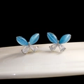 Elegante Schmetterlings-Ohrstecker mit blauem Katzenauge und Zirkonia-Kristallen in Birnform - Palladium Weiß K + Blauer Opal (925 Silberstift)