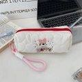 Close-up of quilted pencil case with dog embroidery, red zipper and pink lanyard detail - White (Dog with Large Bow Style)