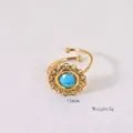 Detail view showing a 15mm diameter turquoise stone on a bohemian gold open ring - Turquoise Blue